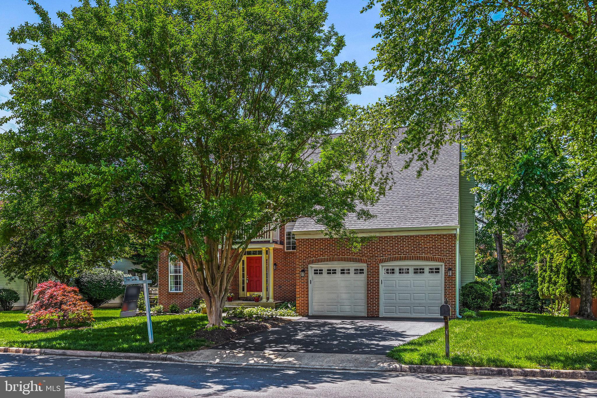 46865 Backwater Drive Sterling, VA 20164 - Photo 1 of 53 a front view of a house with garden