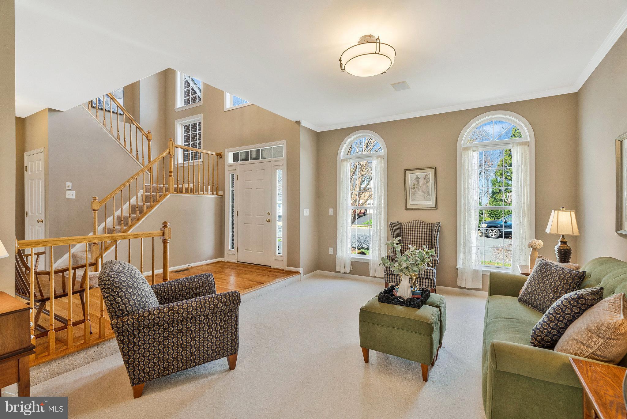 46865 Backwater Drive Sterling, VA 20164 - Photo 20 of 53 a living room with furniture and a potted plant