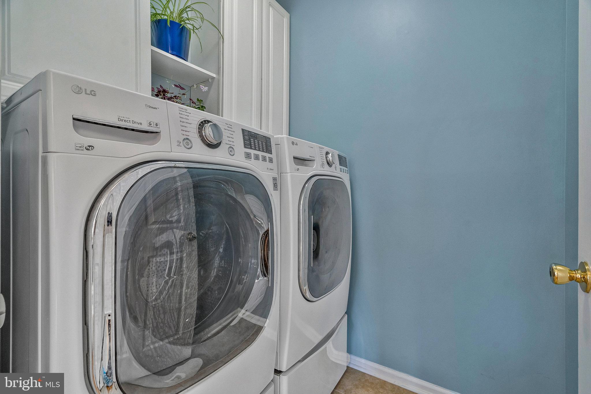 46865 Backwater Drive Sterling, VA 20164 - Photo 21 of 53 a utility room with dryer and washer