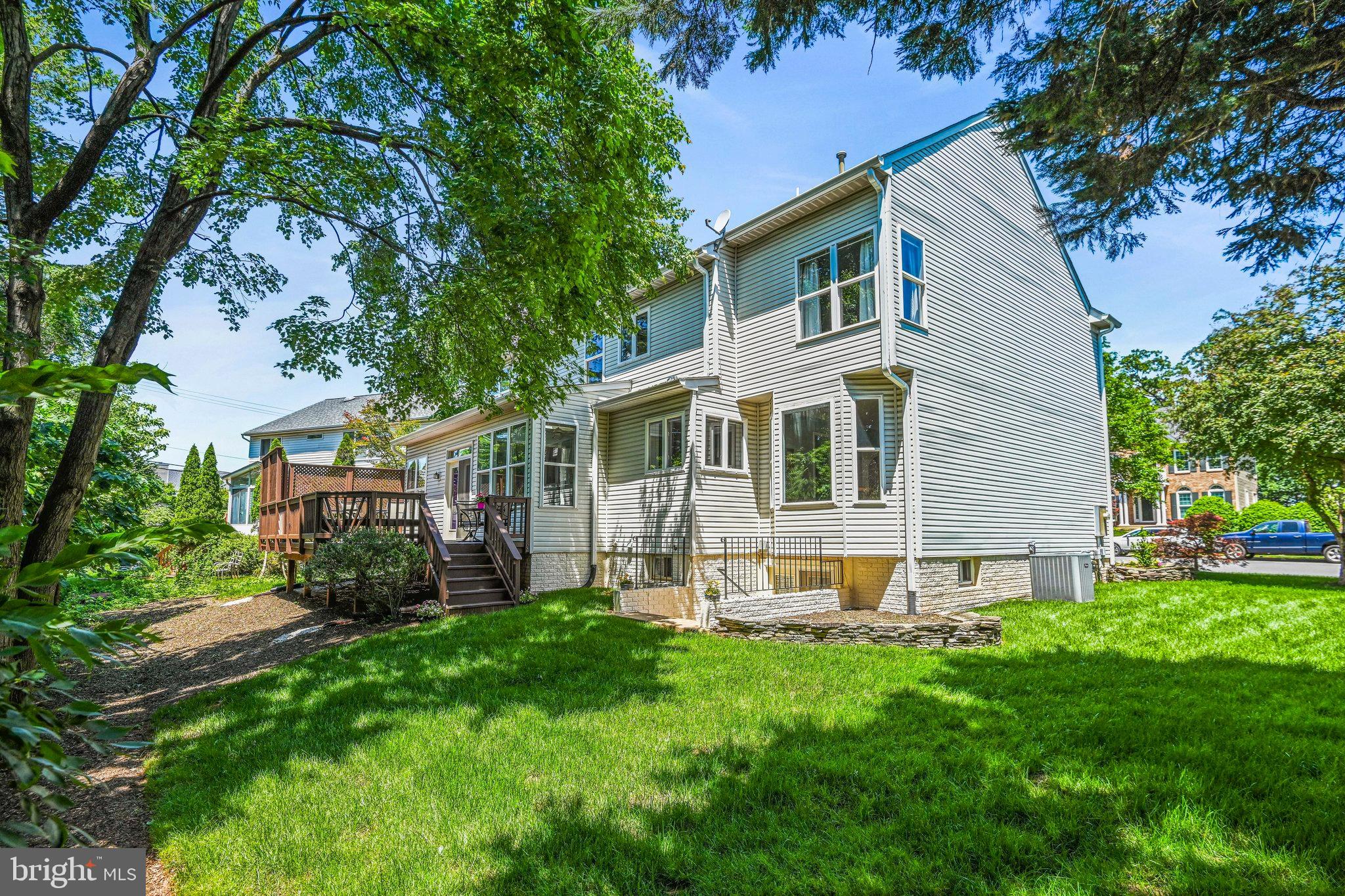 46865 Backwater Drive Sterling, VA 20164 - Photo 3 of 53 a view of a house with a yard and sitting area