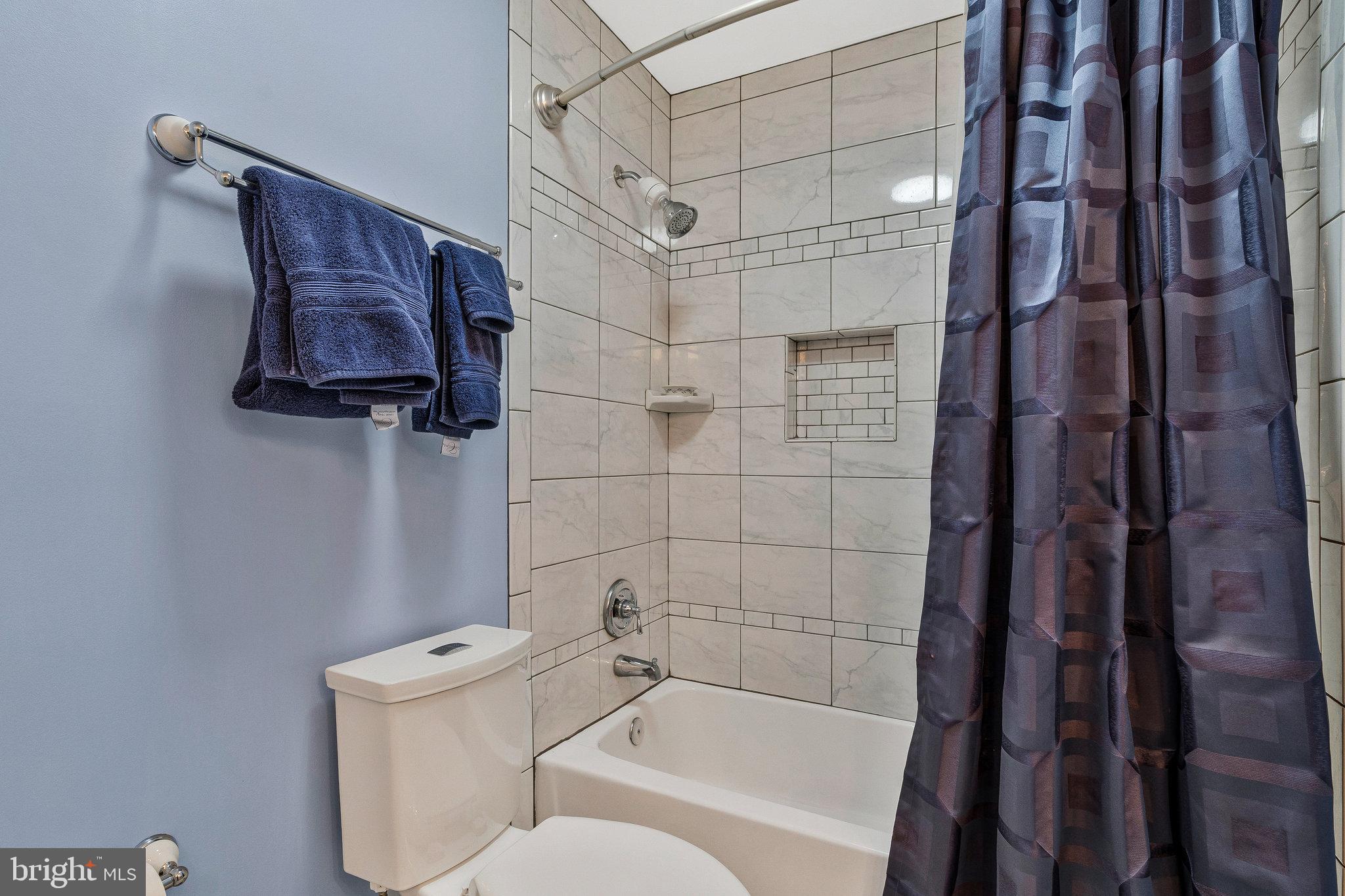 46865 Backwater Drive Sterling, VA 20164 - Photo 39 of 53 a bathroom with a bathtub and shower
