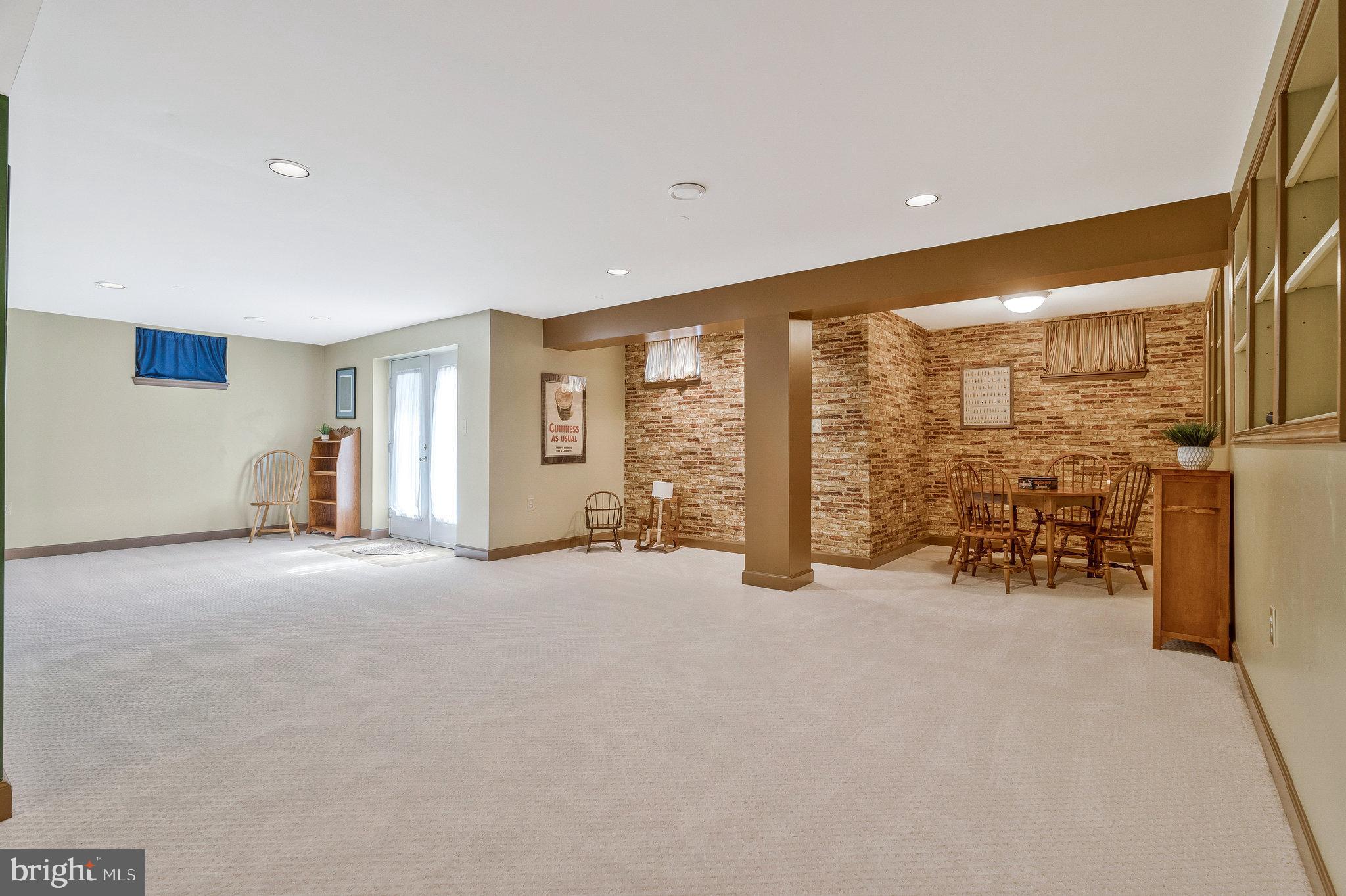 46865 Backwater Drive Sterling, VA 20164 - Photo 40 of 53 a view of an empty room with furniture and a large window
