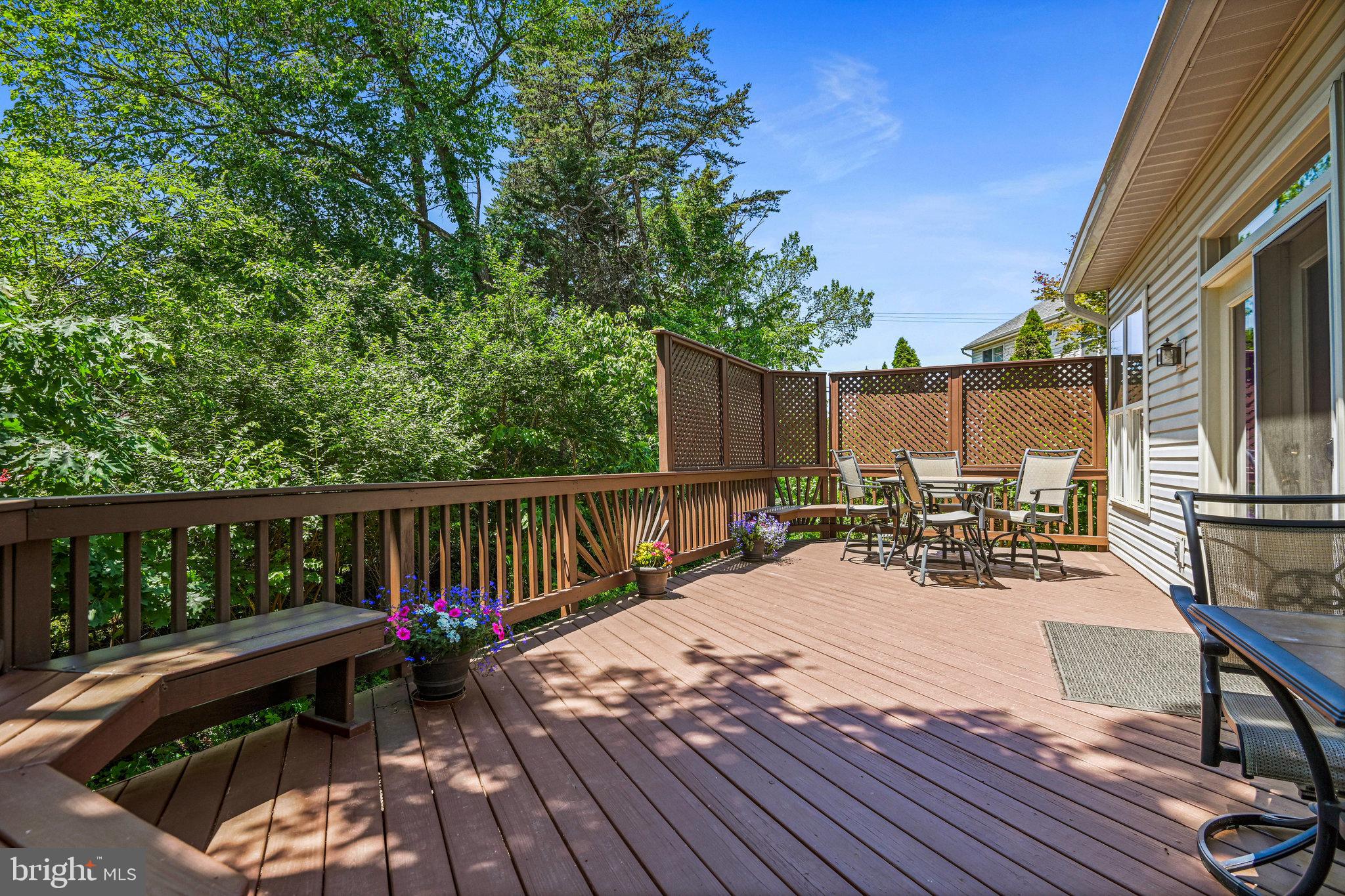 46865 Backwater Drive Sterling, VA 20164 - Photo 48 of 53 a view of balcony with outdoor seating and wooden floor