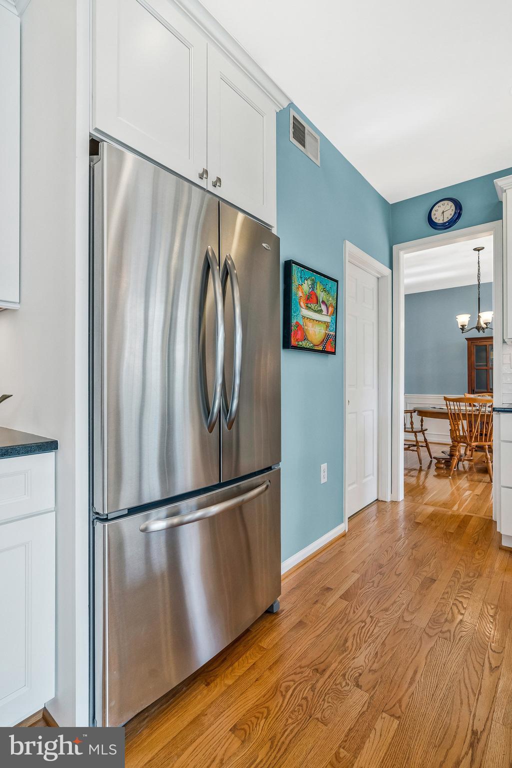 46865 Backwater Drive Sterling, VA 20164 - Photo 10 of 53 a metallic refrigerator freezer sitting in a kitchen