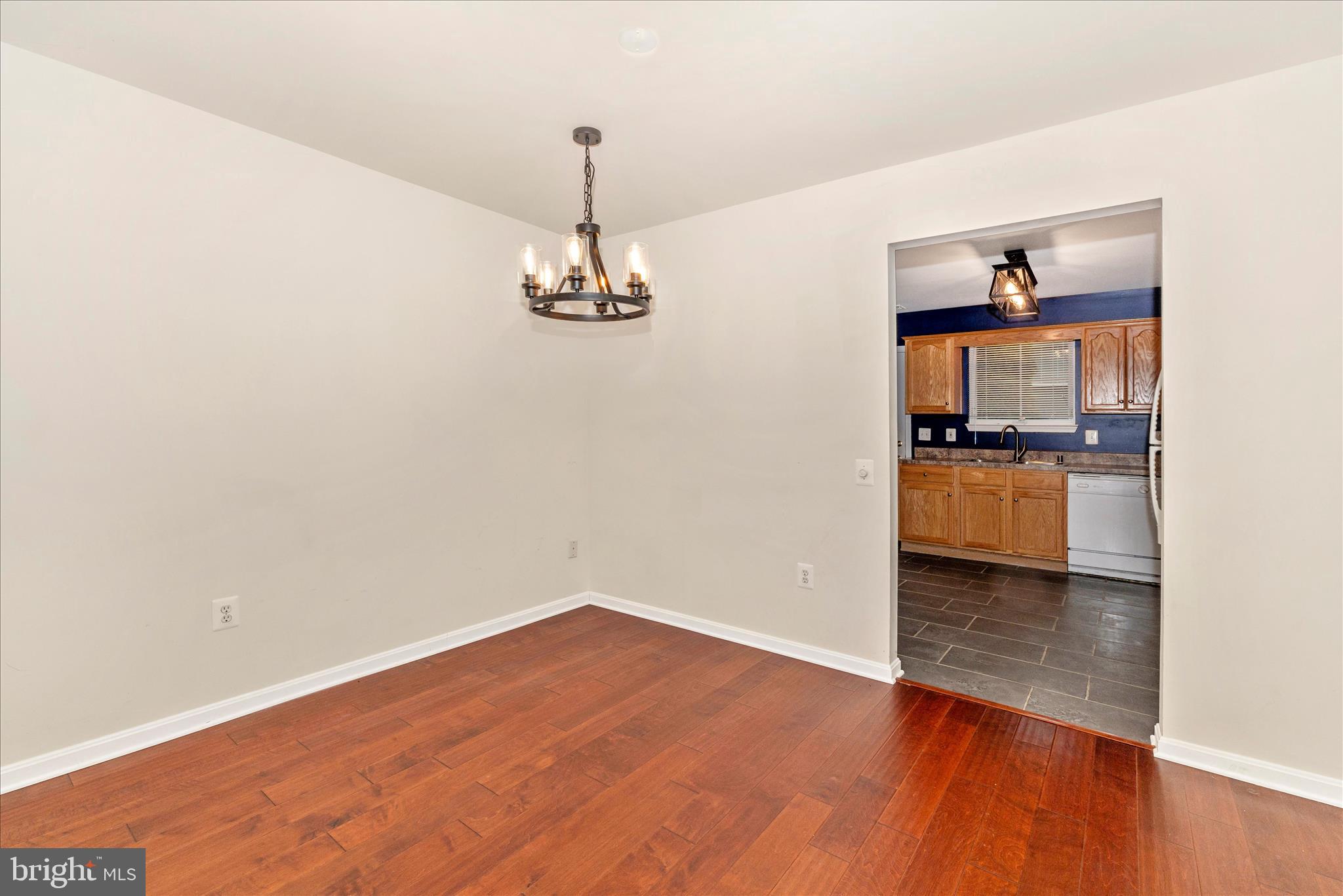 1110 Jousting Way Mount Airy, MD 21771 - Photo 12 of 56 a view of empty room with wooden floor