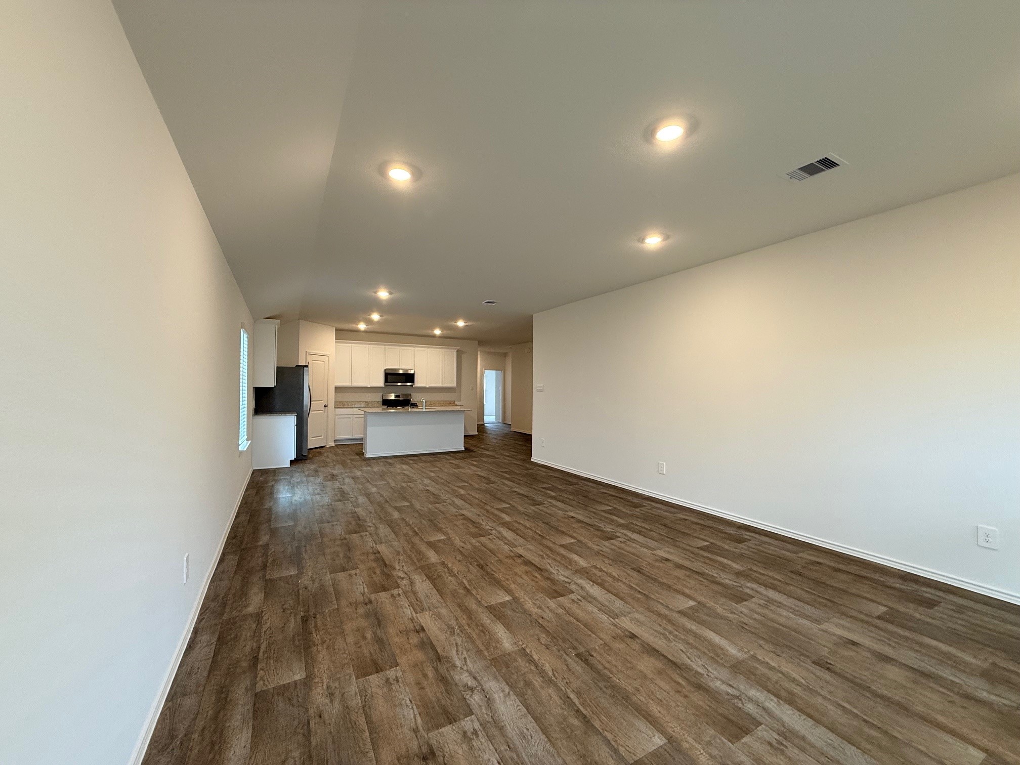 3807 Axyl Run Fulshear, TX 77423 - Photo 13 of 29 a view of empty room with wooden floor