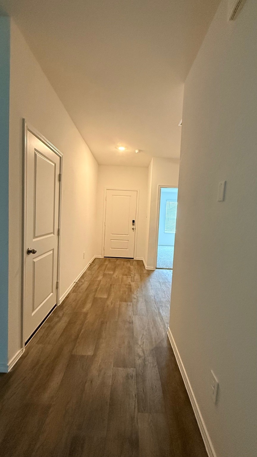 3807 Axyl Run Fulshear, TX 77423 - Photo 14 of 29 a view of empty room with wooden floor