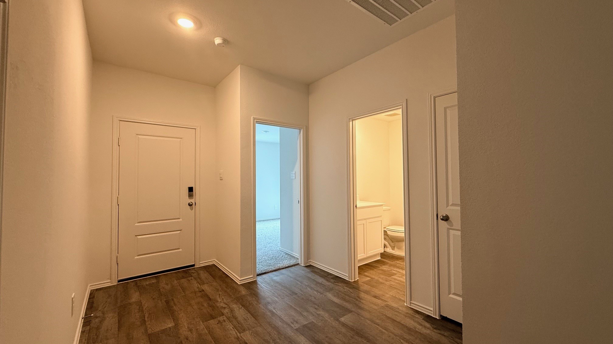 3807 Axyl Run Fulshear, TX 77423 - Photo 15 of 29 a view of an empty room and wooden floor