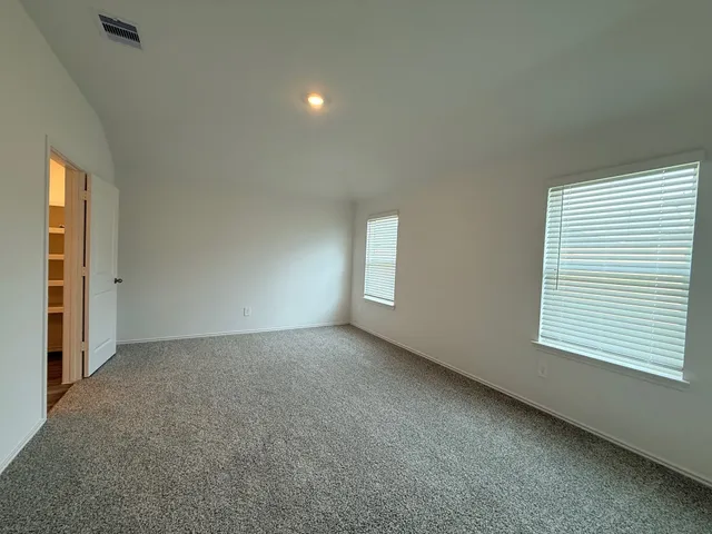 an empty room with windows