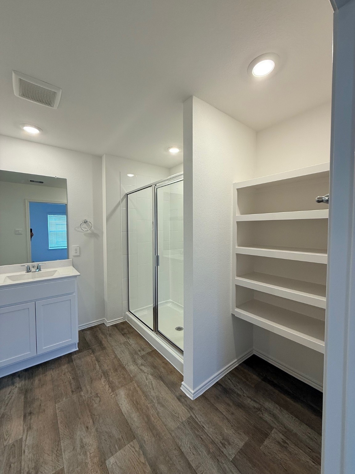 3807 Axyl Run Fulshear, TX 77423 - Photo 17 of 29 a view of an empty room with cabinet and a bathroom