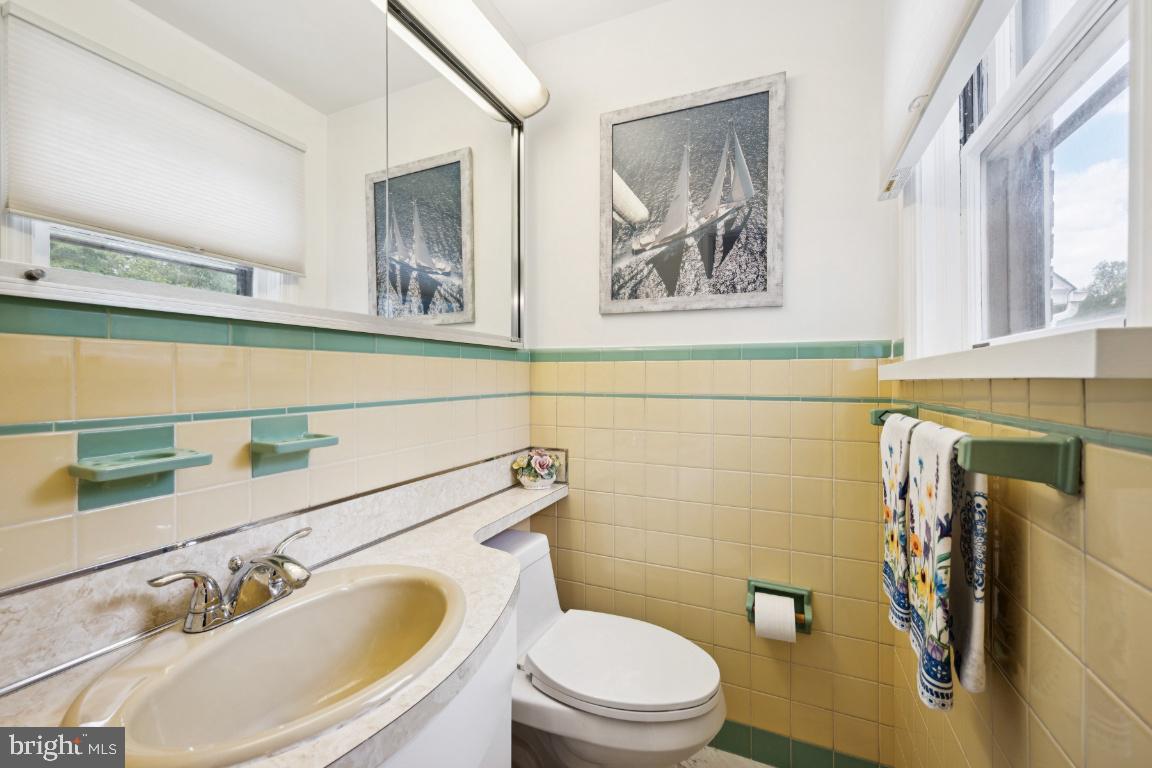 1608 Prospect Ridge Boulevard Haddon Heights, NJ 08035 - Photo 17 of 28 a bathroom with a toilet sink and mirror