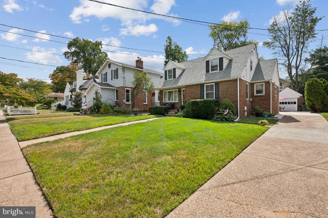 1608 Prospect Ridge Boulevard Haddon Heights, NJ 08035 - Photo 2 of 28 a view of a big house with a big yard and large trees