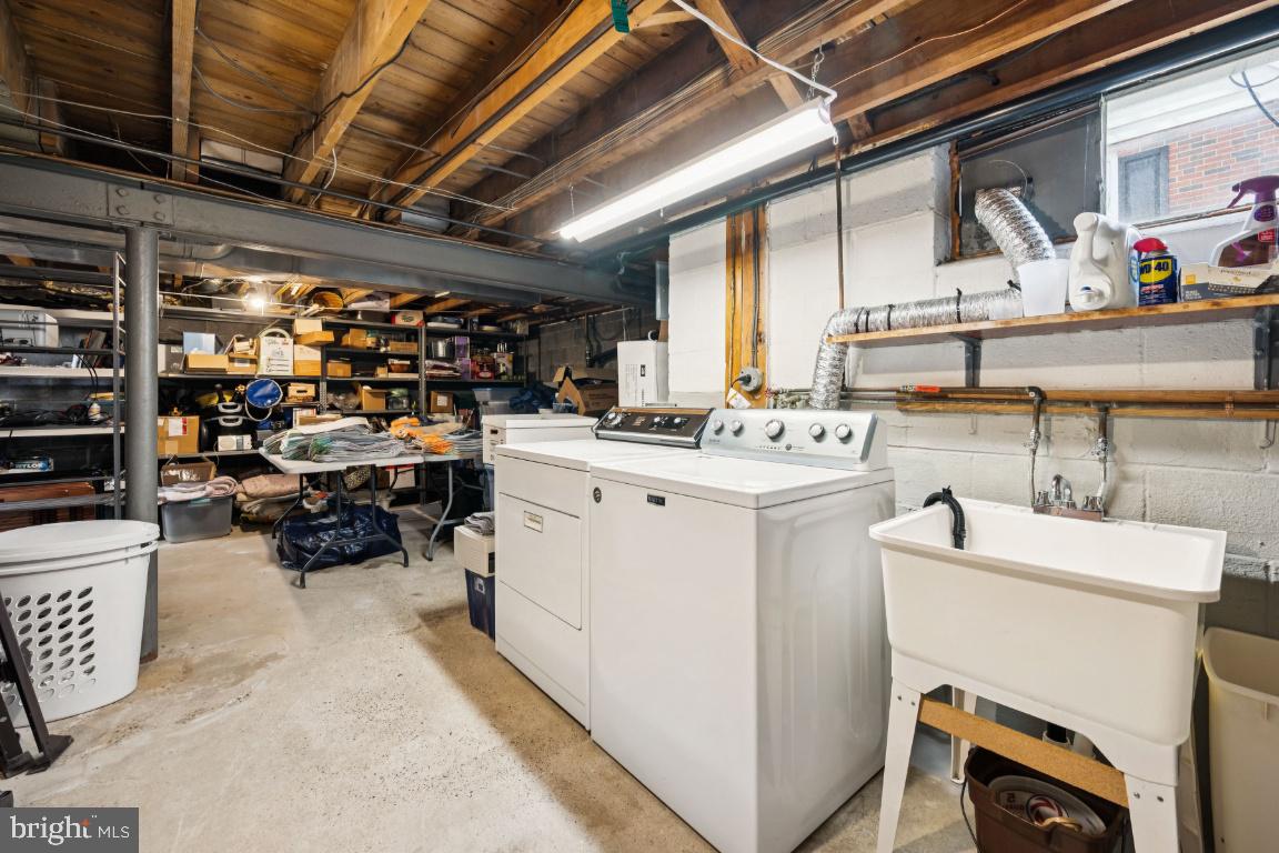 1608 Prospect Ridge Boulevard Haddon Heights, NJ 08035 - Photo 24 of 28 a utility room with dryer washer and a view of living room