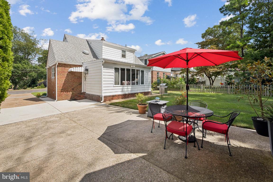 1608 Prospect Ridge Boulevard Haddon Heights, NJ 08035 - Photo 26 of 28 a view of a patio with a table and chairs under an umbrella