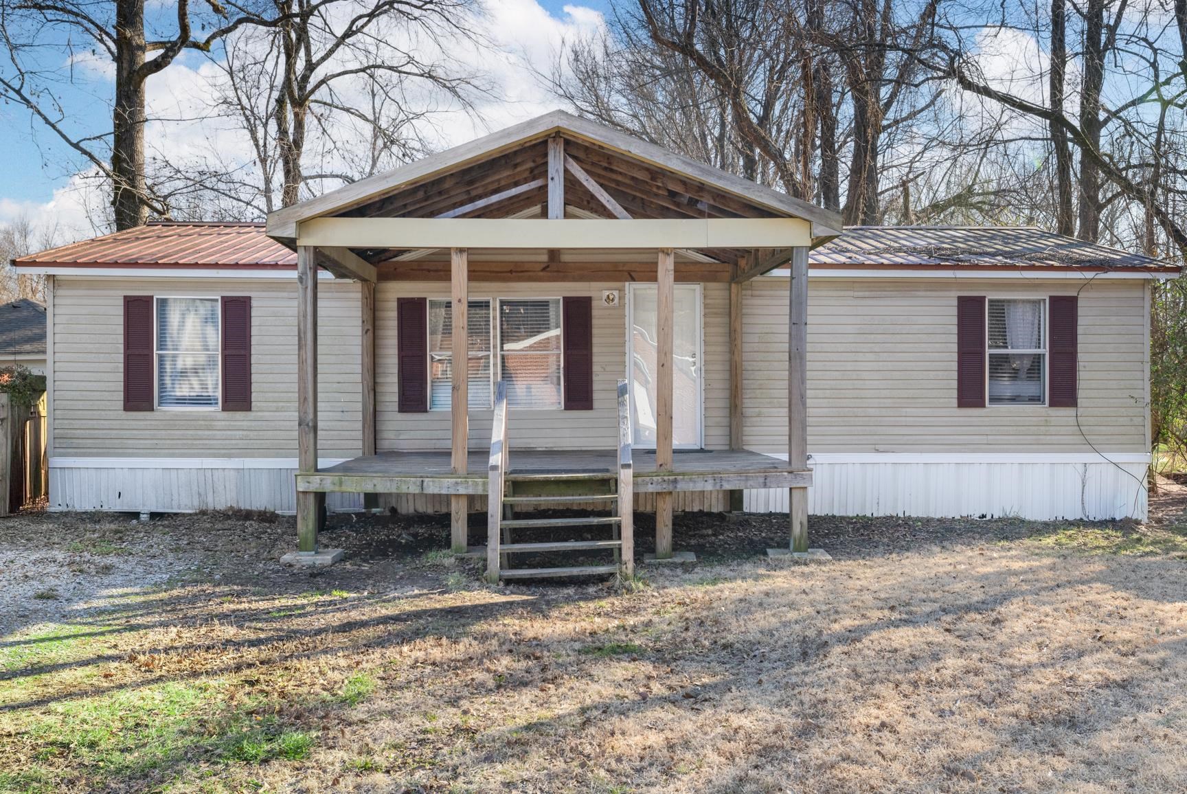7225 Bridgewater Church Road Cordova, TN 38018 - Photo 1 of 20 Manufactured / mobile home featuring a metal roof and a porch