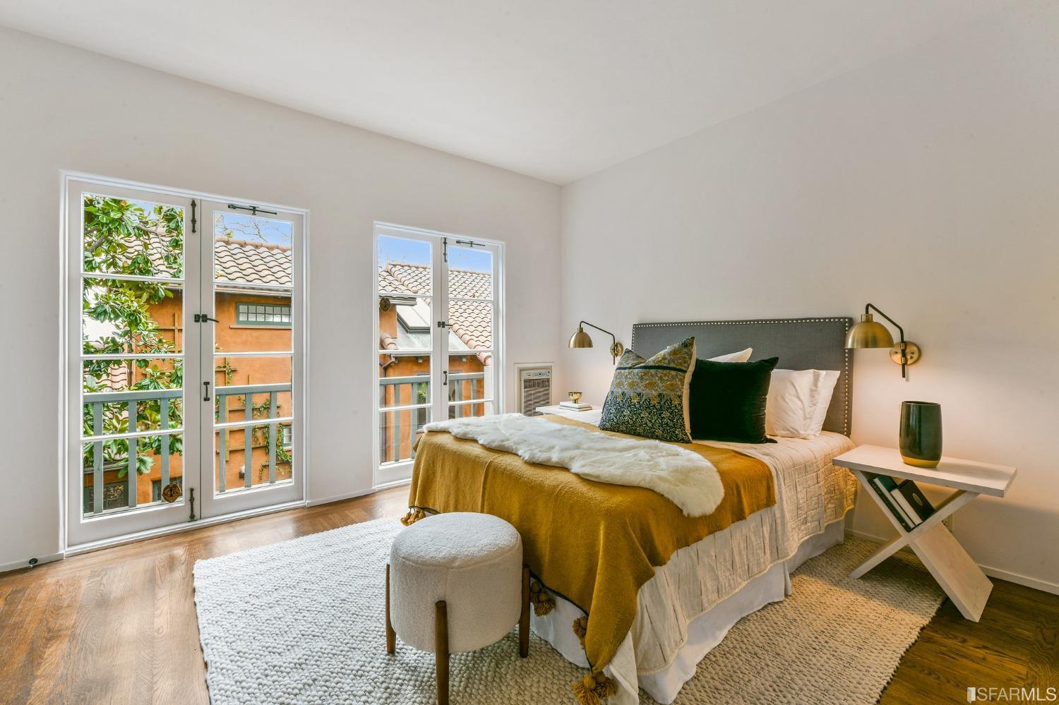 2515 Buena Vista Way Berkeley, CA 94708 - Photo 22 of 52 a bedroom with a bed and wooden floor