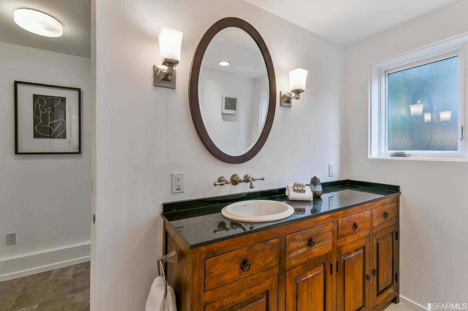 2515 Buena Vista Way Berkeley, CA 94708 - Photo 38 of 52 a bathroom with a sink and a mirror