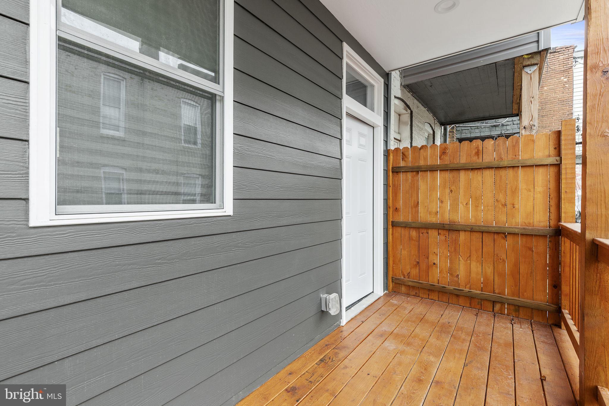 2245 East Preston Street Baltimore, MD 21213 - Photo 16 of 24 a view of a house with a balcony