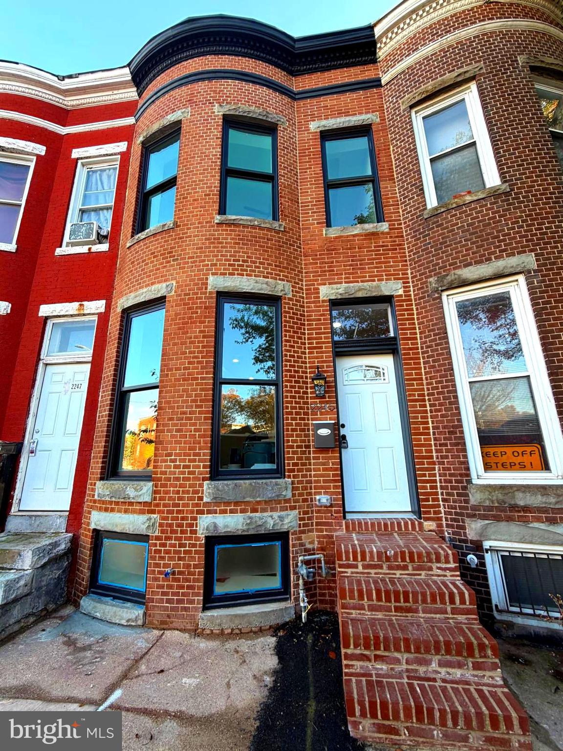 2245 East Preston Street Baltimore, MD 21213 - Photo 24 of 24 a front view of a multi story residential apartment building