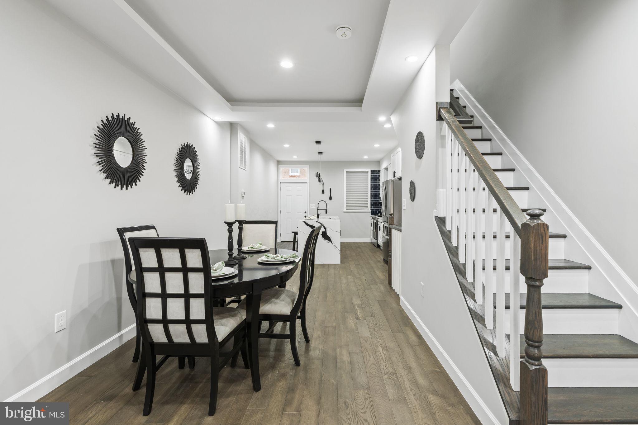 2245 East Preston Street Baltimore, MD 21213 - Photo 3 of 24 an entryway with a dining room and hall with wooden floor