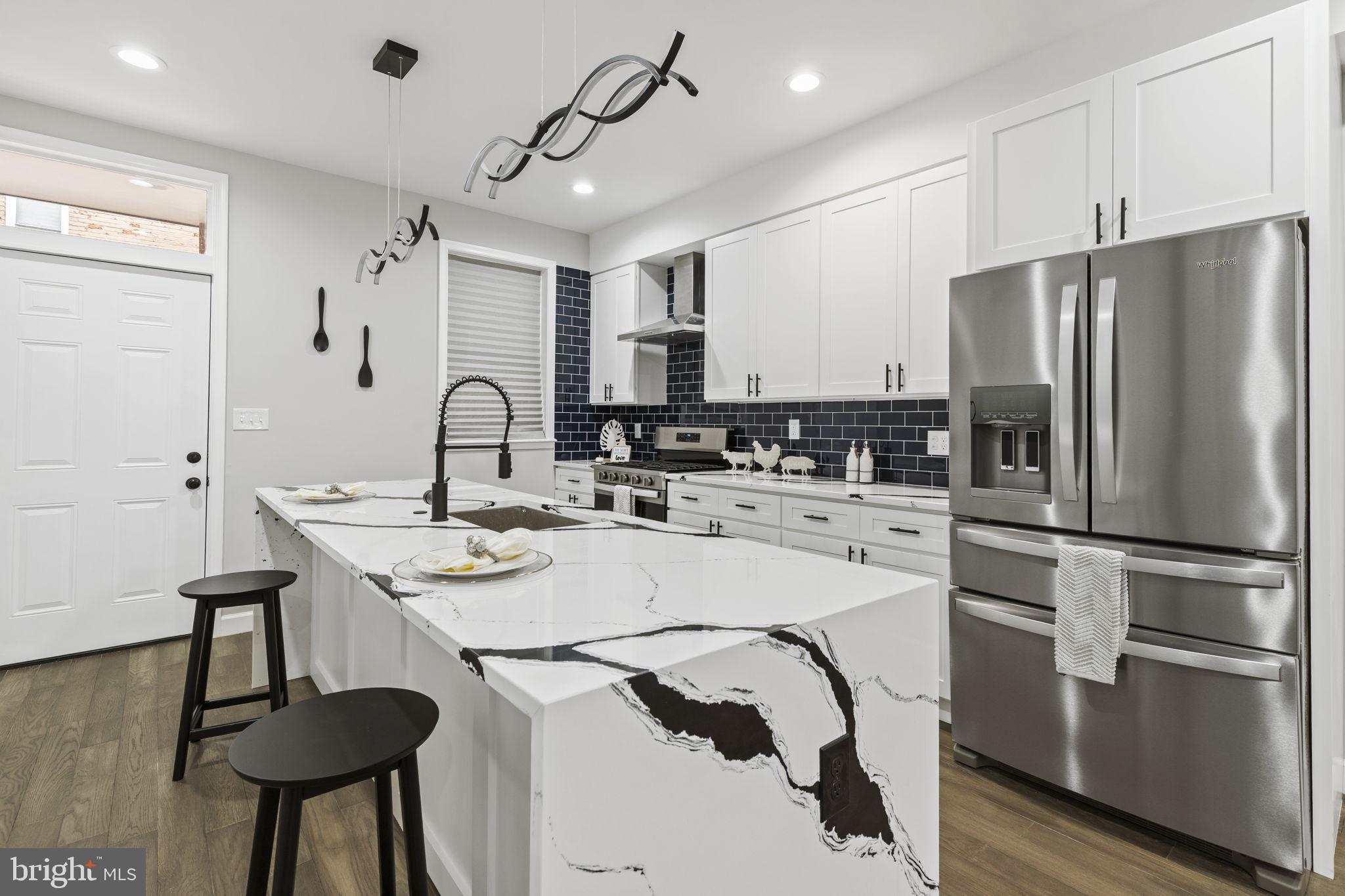 2245 East Preston Street Baltimore, MD 21213 - Photo 4 of 24 a kitchen with appliances a sink and cabinets