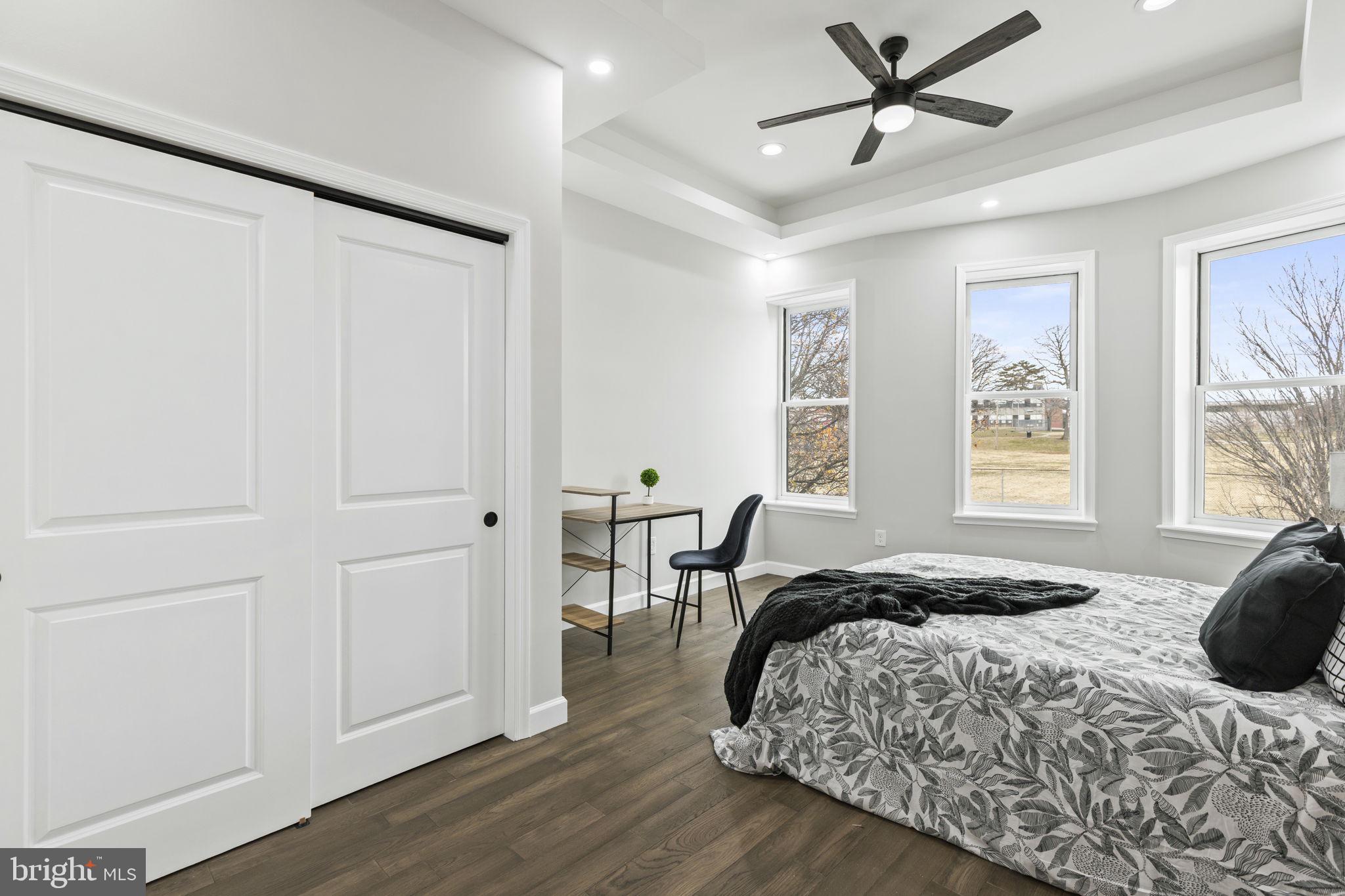 2245 East Preston Street Baltimore, MD 21213 - Photo 6 of 24 a bedroom with a bed and a window
