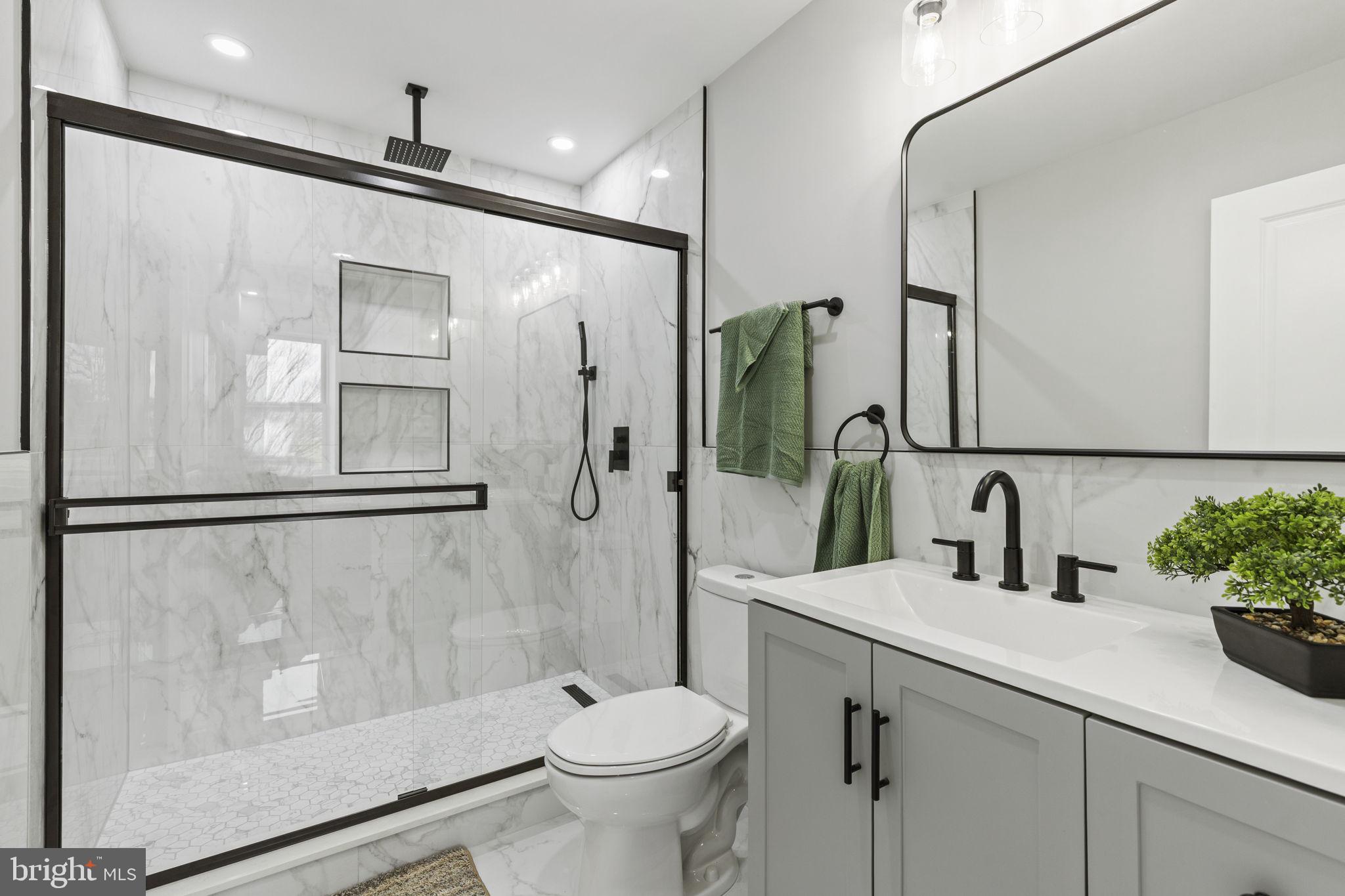 2245 East Preston Street Baltimore, MD 21213 - Photo 8 of 24 a bathroom with a sink toilet and shower