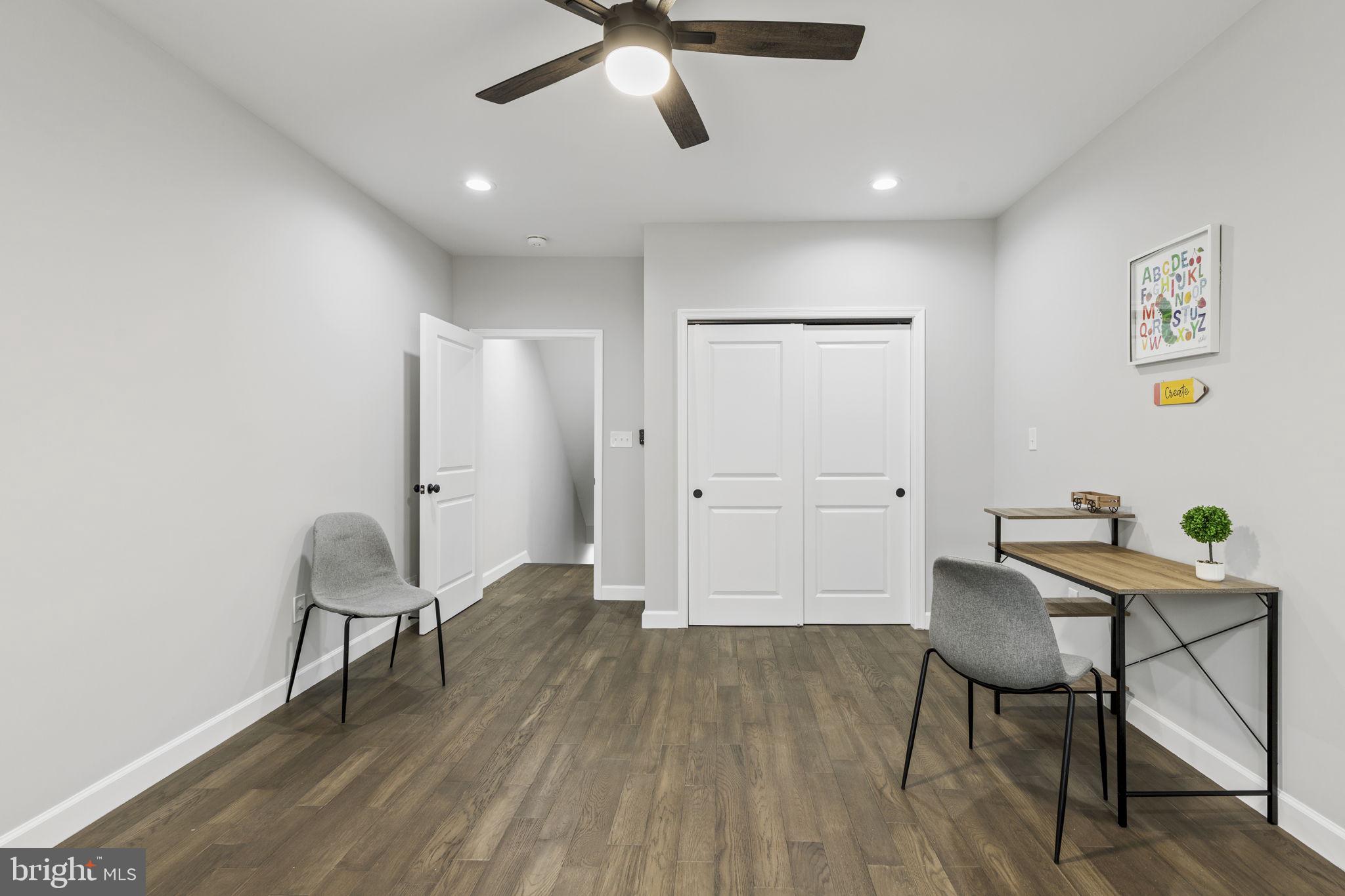 2245 East Preston Street Baltimore, MD 21213 - Photo 10 of 24 a workspace with furniture and wooden floor