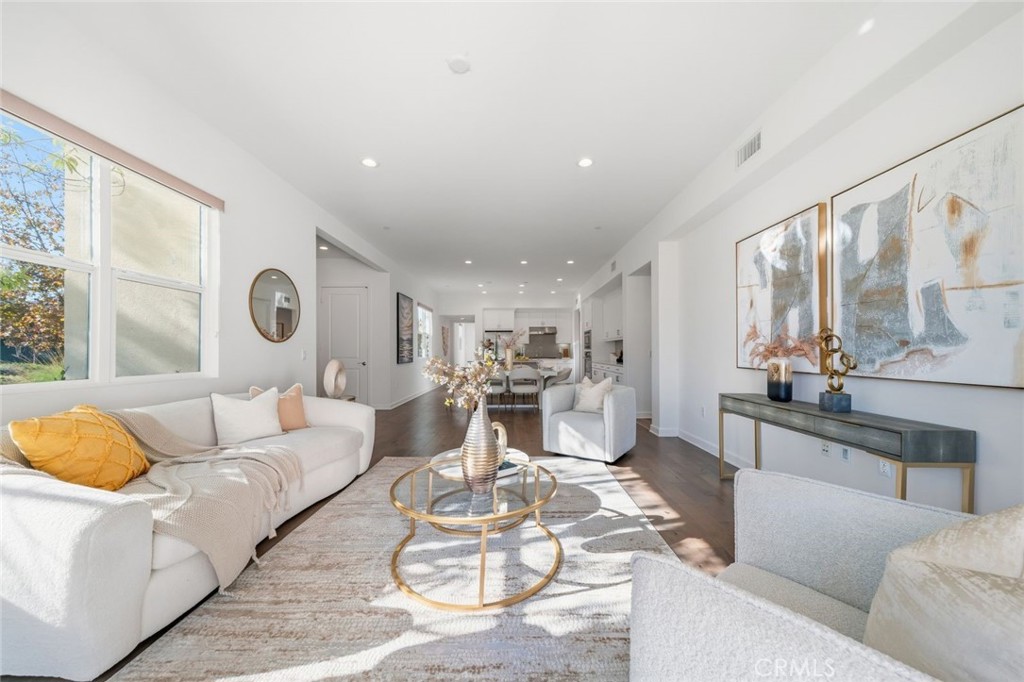 148 Follyhatch Irvine, CA 92618 - Photo 12 of 33 a living room with furniture kitchen and a large window