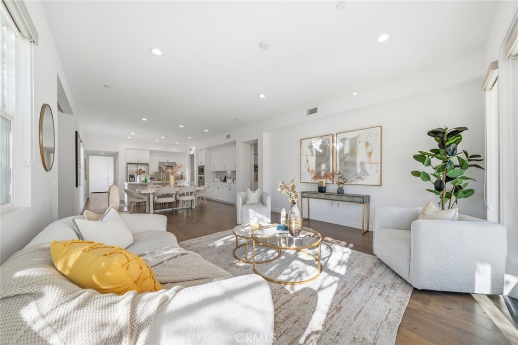 148 Follyhatch Irvine, CA 92618 - Photo 13 of 33 a living room with furniture and a wooden floor