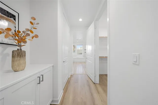 a view of hallway with wooden floor