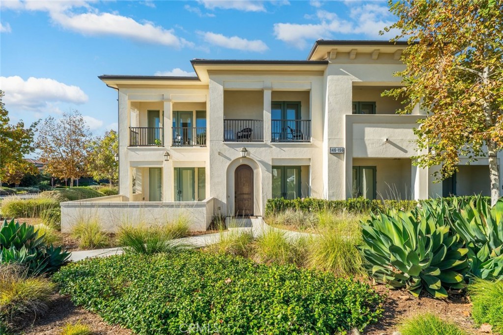 148 Follyhatch Irvine, CA 92618 - Photo 2 of 33 a front view of a house with swimming pool and glass windows