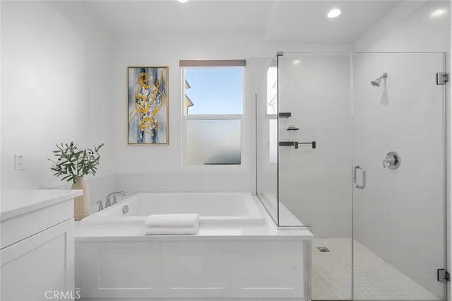 a bathroom with a bathtub and a sink