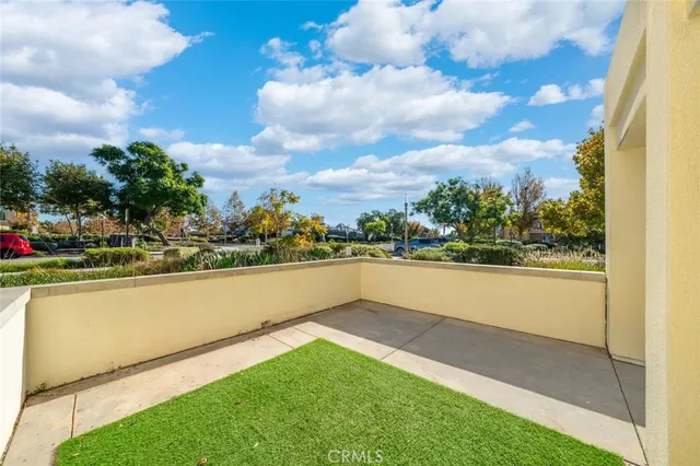 a view of swimming pool with outdoor seating and yard in back