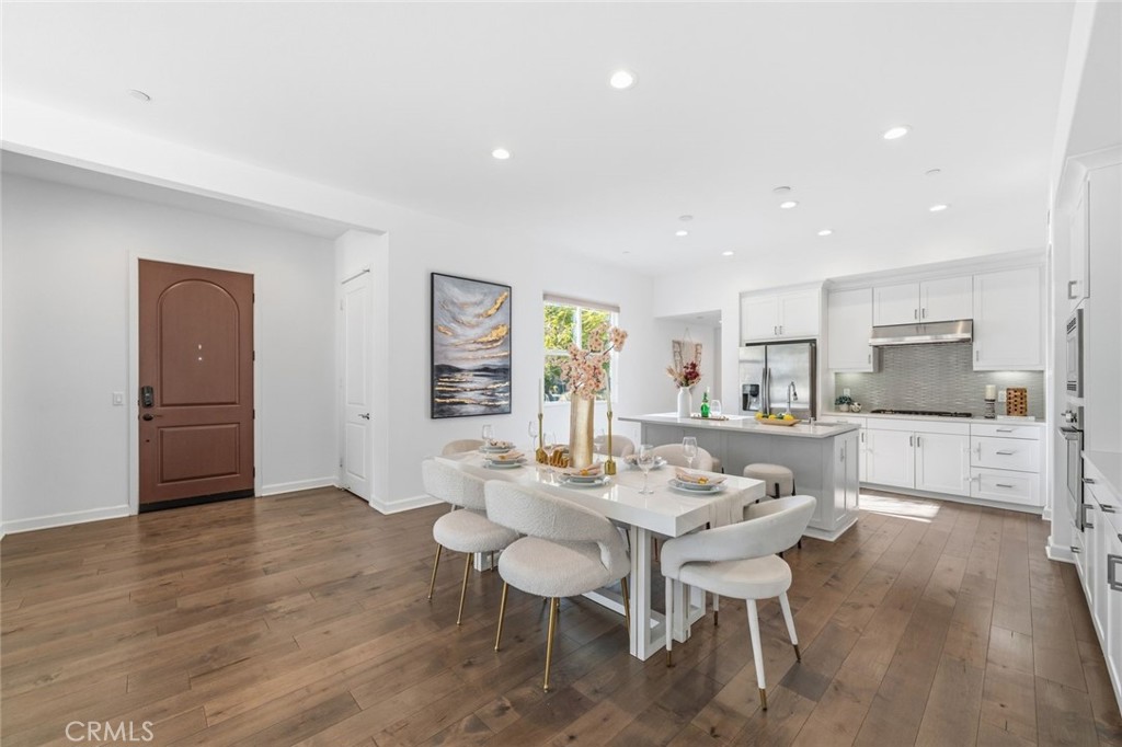 148 Follyhatch Irvine, CA 92618 - Photo 6 of 33 a view of a dining room with furniture and wooden floor