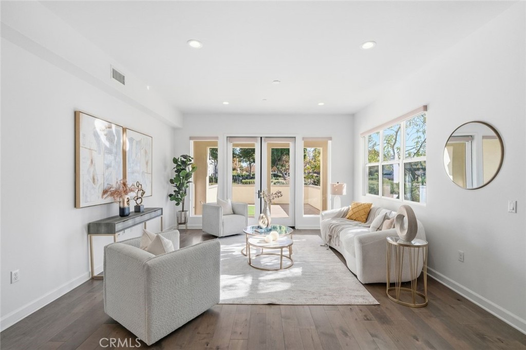 148 Follyhatch Irvine, CA 92618 - Photo 10 of 33 a living room with furniture and a large window