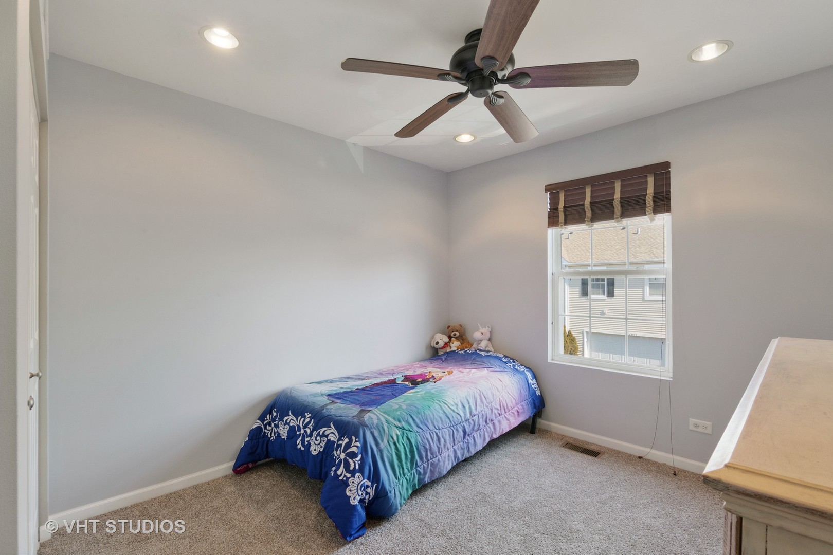 1842 Powers Road Woodstock, IL 60098 - Photo 8 of 12 a bedroom with a bed and a window