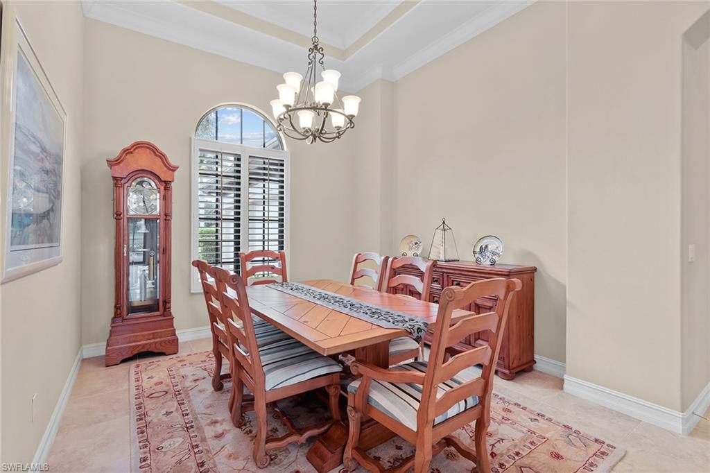 7440 Byrons Way Naples, FL 34113 - Photo 13 of 43 a view of a dining room with furniture
