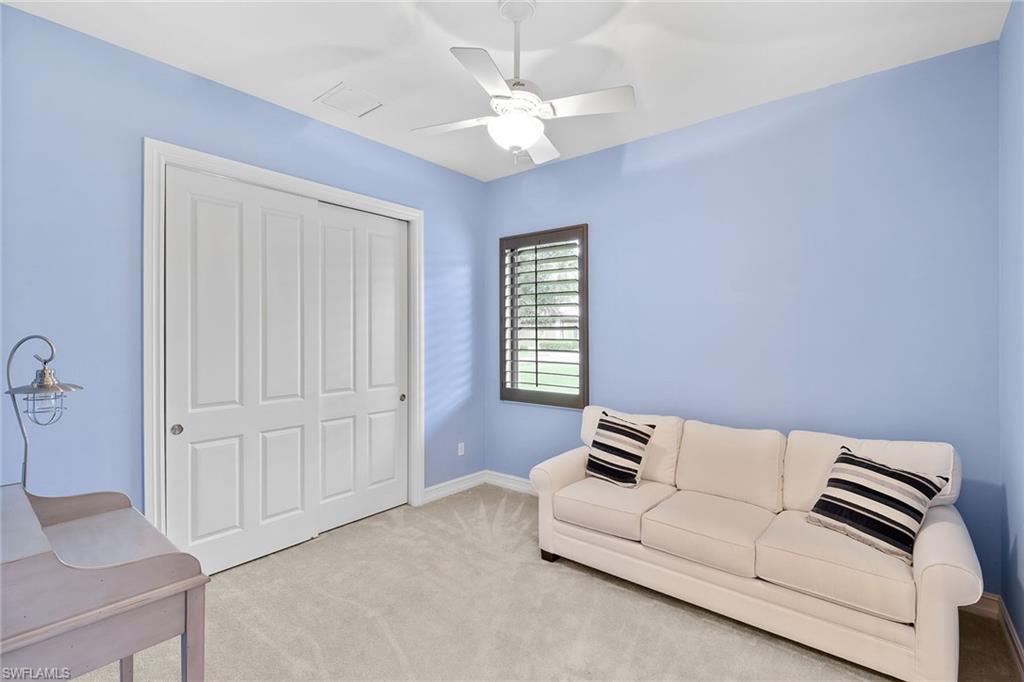 7440 Byrons Way Naples, FL 34113 - Photo 19 of 43 a living room with furniture and a ceiling fan
