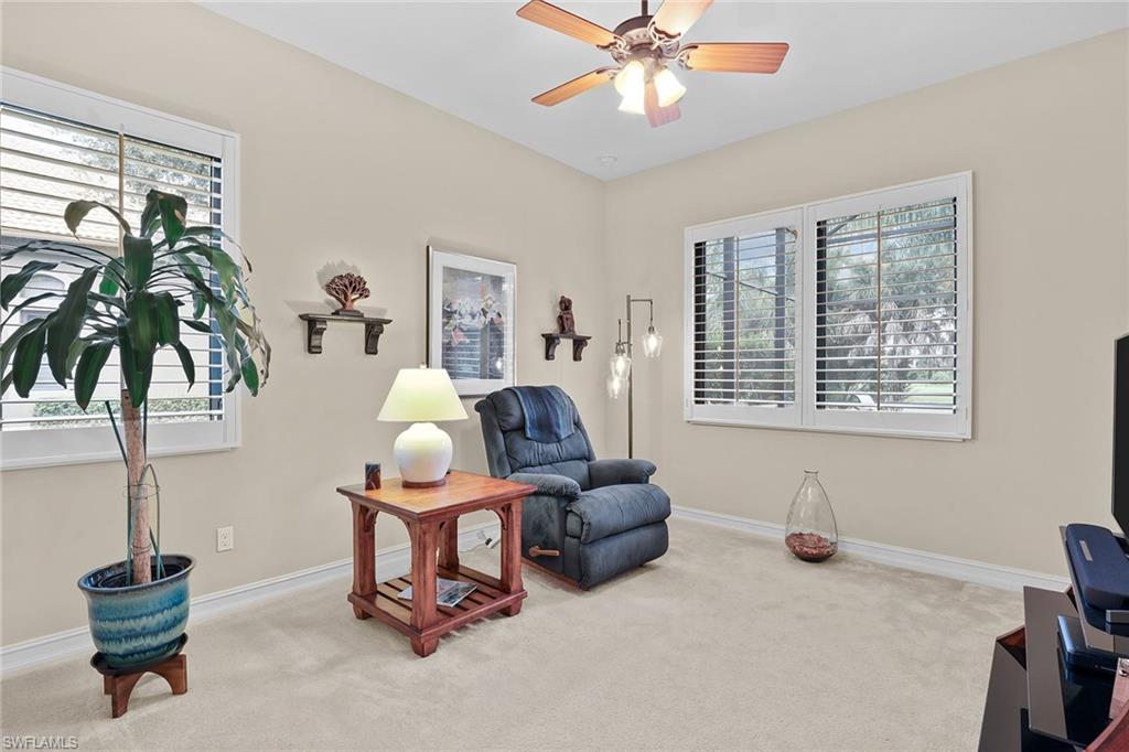 7440 Byrons Way Naples, FL 34113 - Photo 21 of 43 a living room with furniture and a window