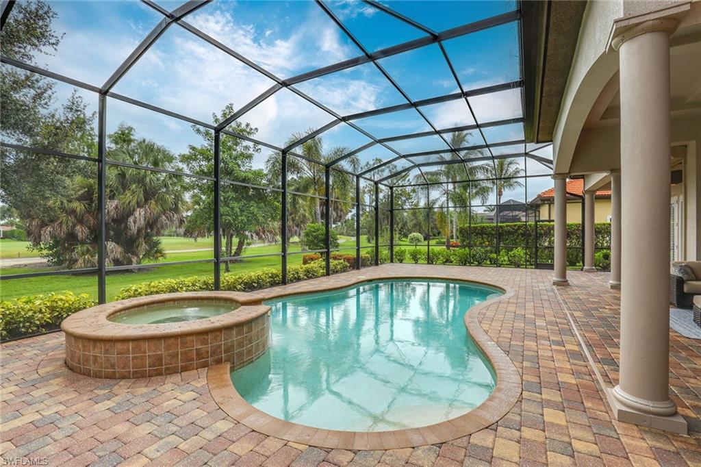 7440 Byrons Way Naples, FL 34113 - Photo 30 of 43 a view of a swimming pool with a patio