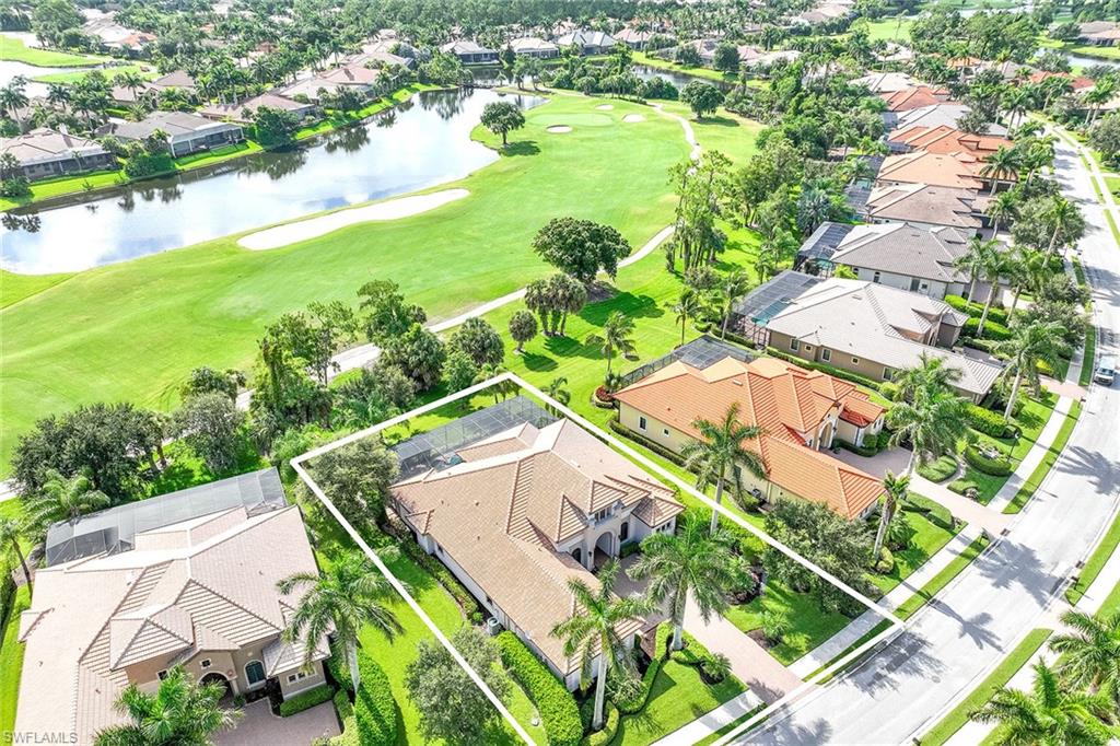 7440 Byrons Way Naples, FL 34113 - Photo 36 of 43 a view of a lake with a yard