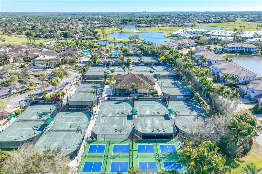 7440 Byrons Way Naples, FL 34113 - Photo 39 of 43 an aerial view of residential houses with outdoor space and swimming pool