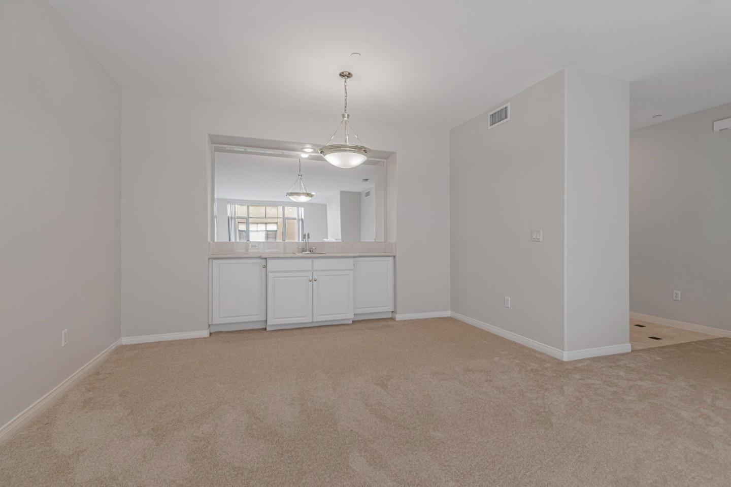 144 South 3rd Street, Unit 433 San Jose, CA 95112 - Photo 20 of 66 an empty room with a bathroom and mirror