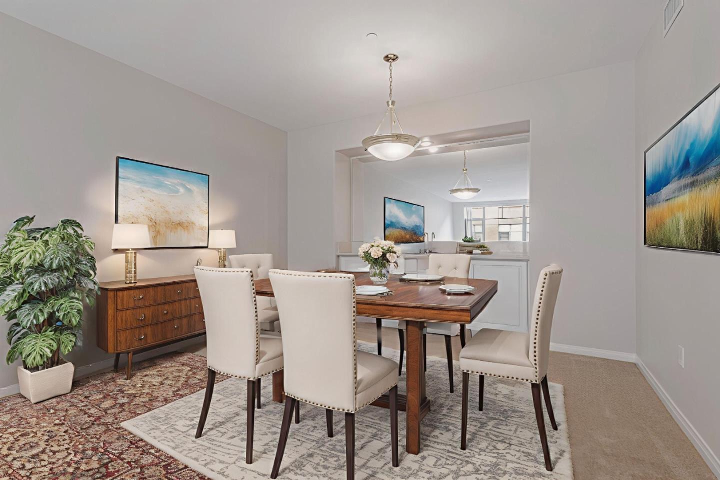 144 South 3rd Street, Unit 433 San Jose, CA 95112 - Photo 2 of 66 a view of a dining room with furniture and a potted plant