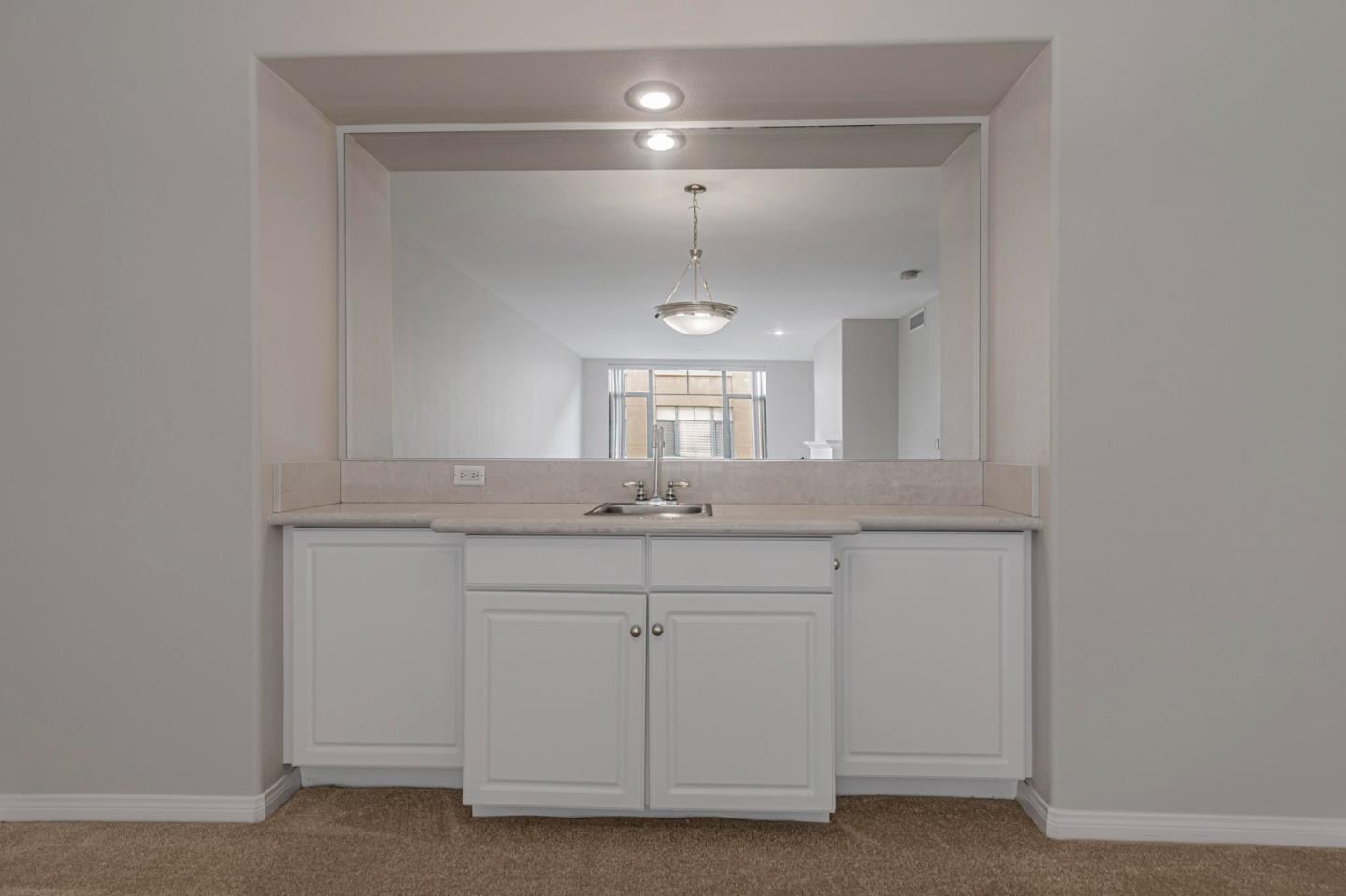 144 South 3rd Street, Unit 433 San Jose, CA 95112 - Photo 21 of 66 a bathroom with a sink and a mirror