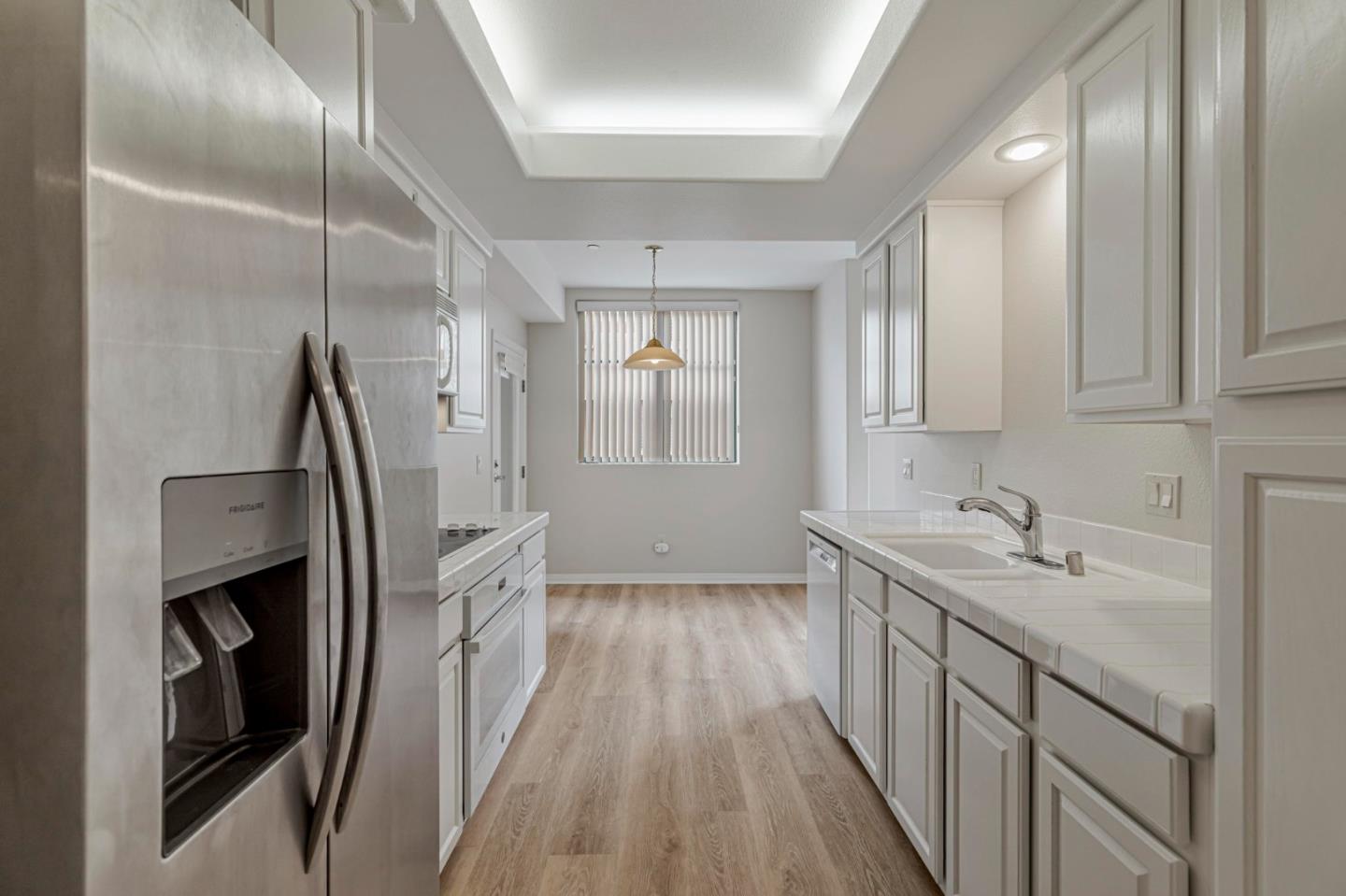 144 South 3rd Street, Unit 433 San Jose, CA 95112 - Photo 22 of 66 a kitchen with granite countertop a sink and refrigerator