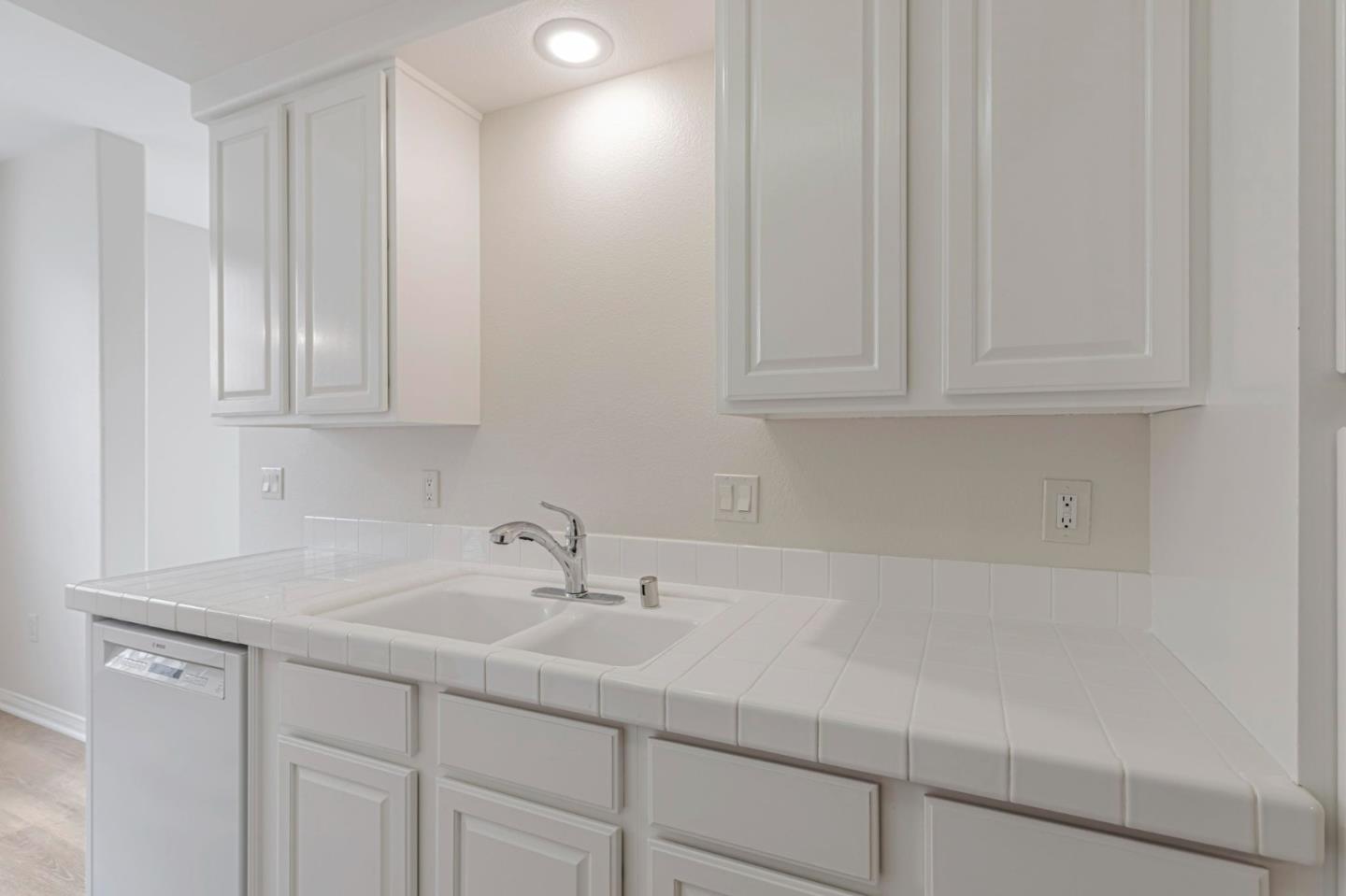 144 South 3rd Street, Unit 433 San Jose, CA 95112 - Photo 27 of 66 a sink with white cabinets