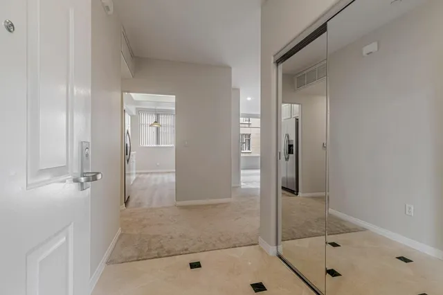 a bathroom with a sink a large mirror and a shower