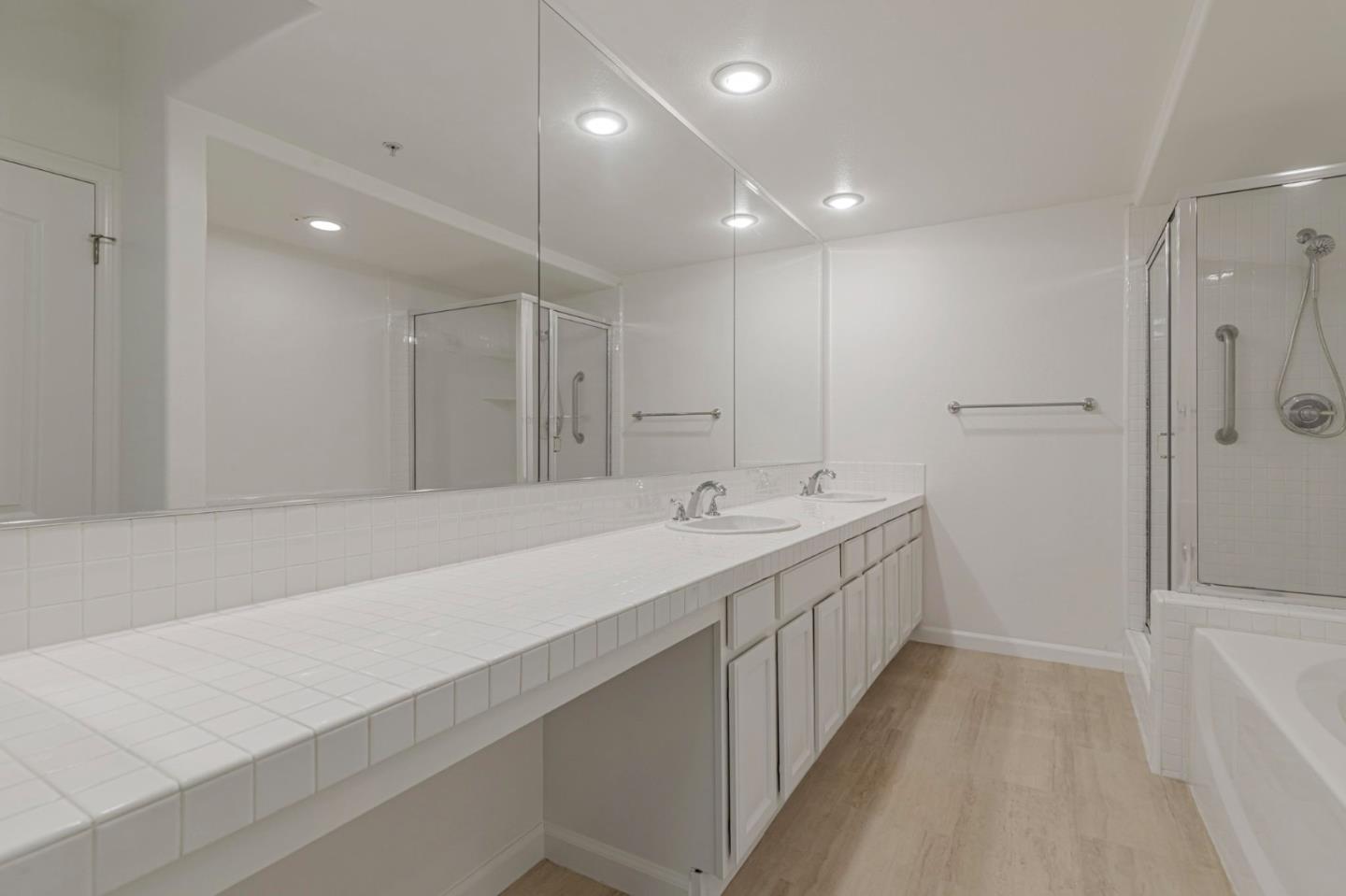 144 South 3rd Street, Unit 433 San Jose, CA 95112 - Photo 39 of 66 a bathroom with a double vanity sink and mirror